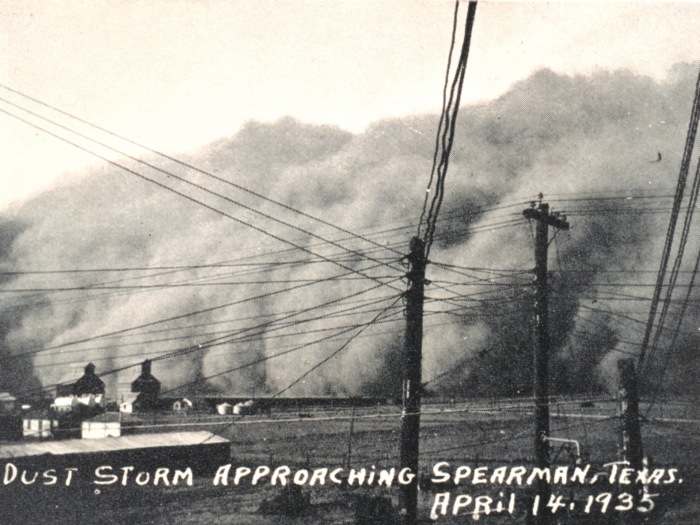 A dust storm in the 1930's in Spearman, Texas during the Dust Bowl; depicting a black bizzard